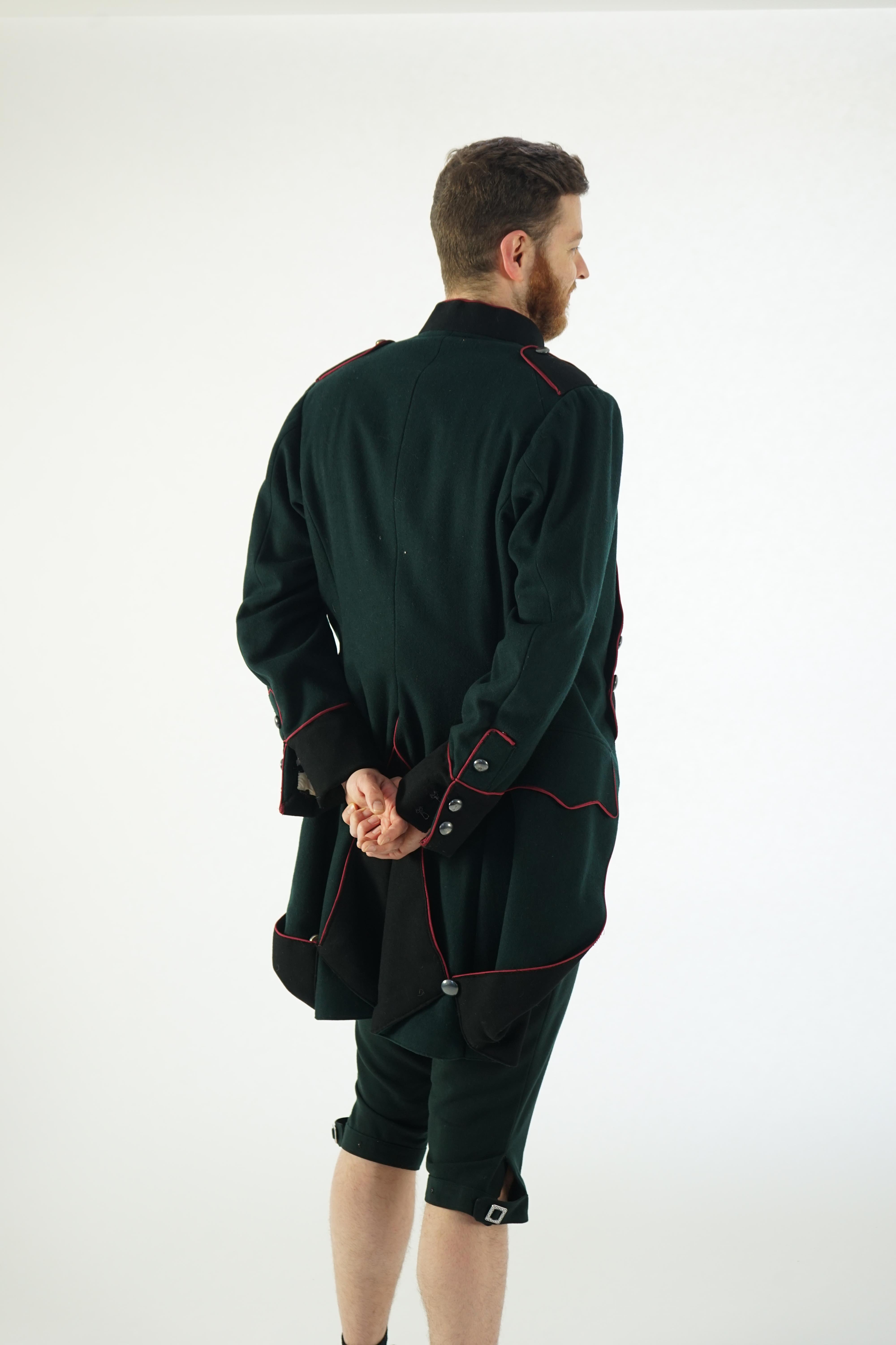 A dark green and black 18th Century style military uniform (jacket, waistcoat and breeches). Ex Royal Opera House - Soldier 'The Barber of Seville' 1993